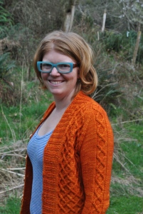 I made me a sweater.  It's orange.  It has handmade, homegrown buttons on it.  Seriously.  I win.
